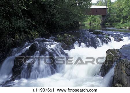 waterfall, covered bridge, river, spring, Northfield Falls, VT, Vermont, Slaughter House Covered Bridge crosses over Dog River in the spring in Northfield Falls. View Large Photo Image Stock Image - waterfall, covered bridge, river, spring, Northfield Falls, VT, Vermont, Slaughter House Covered Bridge crosses over Dog River in the spring in Northfield Falls.. Fotosearch