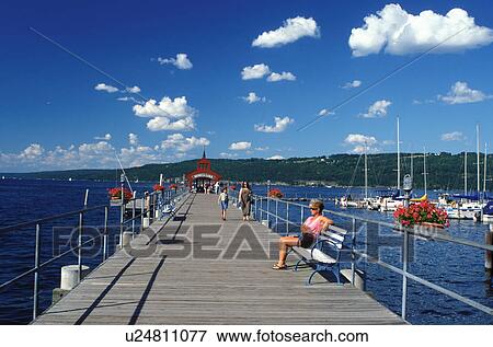 Watkins Glen, NY, New York, Finger Lakes, Seneca Lake, People enjoying a sunny day on the Watkins Glen Public Pier on Seneca Lake. View Large Photo Image Stock Photo - Watkins Glen, NY, New York, Finger Lakes, Seneca Lake, People enjoying a sunny day on the Watkins Glen Public Pier on Seneca Lake.. Fotosearch
