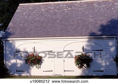 white barn, Maine, ME, Pemaquid, White wooden garage with hanging red flowers in Fort Point. View Large Photo Image Stock Image - white barn, Maine, ME, Pemaquid, White wooden garage with hanging red flowers in Fort Point. . Fotosearch