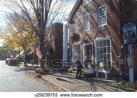 Stock Image -  Woodstock, VT, Vermont, Shops in downtown Woodstock in autumn.. Fotosearch