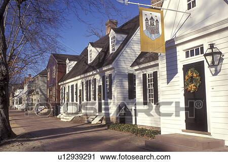 Stock Image -  wreath, Christmas, Colonial Williamsburg, Virginia, VA, Williamsburg, Christmas wreaths hang on the doors of the village stores in Colonial Williamsburg.. Fotosearch