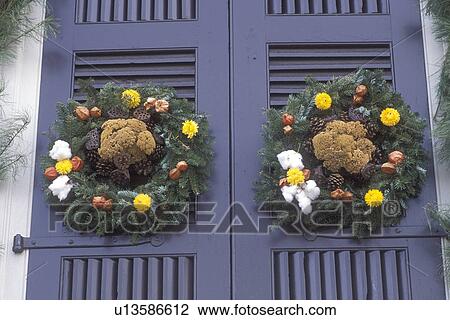wreath, Colonial Williamsburg, Virginia, VA, Williamsburg, Two wreaths made of greens, dried flowers and fruit decorates the door of a home for Christmas in Colonial Williamsburg. View Large Photo Image Stock Image - wreath, Colonial Williamsburg, Virginia, VA, Williamsburg, Two wreaths made of greens, dried flowers and fruit decorates the door of a home for Christmas in Colonial Williamsburg.. Fotosearch