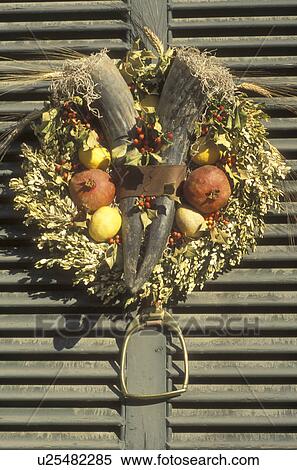 wreath, Colonial Williamsburg, Virginia, VA, Williamsburg, A wreath made of greens, dried flowers and gourds decorates the door of a home for Christmas in Colonial Williamsburg. View Large Photo Image Stock Photography -  wreath, Colonial Williamsburg, Virginia, VA, Williamsburg, A wreath made of greens, dried flowers and gourds decorates the door of a home for Christmas in Colonial Williamsburg.. Fotosearch