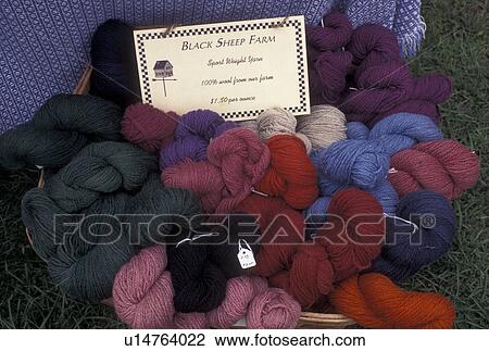 Stock Image -  yarn, Vermont, VT, Different colors of wool yarn displayed in a basket at the Saturday Farmers Market in Montpelier. . Fotosearch