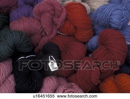 Stock Photography -  yarn, Vermont, VT, Different colors of wool yarn displayed in a basket at the Saturday Farmers Market in Montpelier. . Fotosearch
