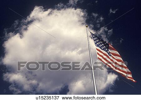 American Flag, sky, clouds, The U. S. flag waving in the wind against a blue sky in Atlanta, GA. View Large Photo Image Stock Photo - American Flag, sky, clouds, The U. S. flag waving in the wind against a blue sky in Atlanta, GA.. Fotosearch