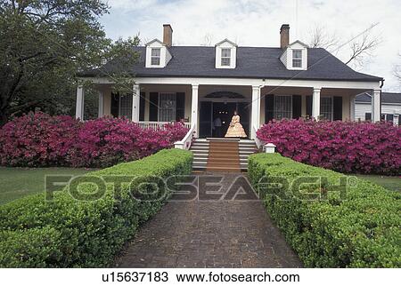 Stock Image -  antebellum, Natchez, MS, Mississippi, Spring Pilgrimage, Woman dressed in antebellum costume at the Hawthorne House at The Natchez Pilgrimage. . Fotosearch