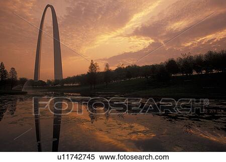 arch, Gateway Arch, St. Louis, MO, Missouri, The Gateway Arch reflects in the pond at sunrise in Saint Louis. Jefferson National Expansion Memorial. Gateway to the West. View Large Photo Image Stock Photography - arch, Gateway Arch, St. Louis, MO, Missouri, The Gateway Arch reflects in the pond at sunrise in Saint Louis. Jefferson National Expansion Memorial. Gateway to the West.. Fotosearch