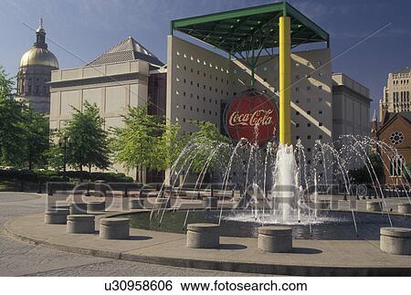Stock Photograph -  Atlanta, GA, coca cola, Underground Atlanta, Georgia, Fountain at the plaza outside World of Coca-Cola Atlanta in downtown Atlanta. . Fotosearch