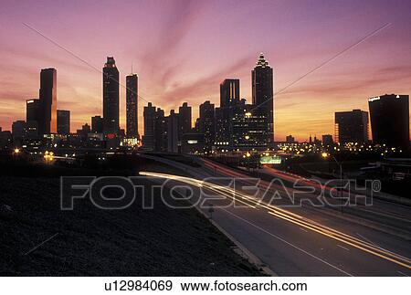 Atlanta, GA, Georgia, Traffic lights streak on Freedom Parkway at sunset and view of the skyline of downtown Atlanta. View Large Photo Image Stock Photo - Atlanta, GA, Georgia, Traffic lights streak on Freedom Parkway at sunset and view of the skyline of downtown Atlanta.. Fotosearch