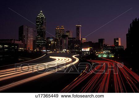 Atlanta, GA, Georgia, Traffic lights streak on I-75/I-85 at sunset and view of the skyline of downtown Atlanta. View Large Photo Image Stock Photo - Atlanta, GA, Georgia, Traffic lights streak on I-75/I-85 at sunset and view of the skyline of downtown Atlanta.. Fotosearch