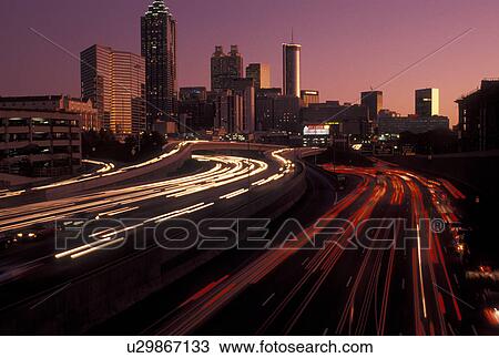 Atlanta, GA, skyline, expressway, Georgia, Skyline of downtown Atlanta and streaks of car lights on I-75 and I-85 connector at sunset. View Large Photo Image Stock Image - Atlanta, GA, skyline, expressway, Georgia, Skyline of downtown Atlanta and streaks of car lights on I-75 and I-85 connector at sunset.. Fotosearch