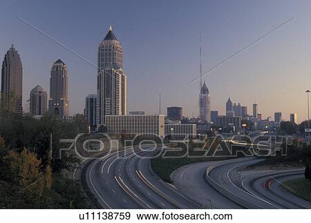 Stock Photo -  Atlanta, GA, skyline, expressway, Georgia, Skyline of downtown Atlanta and I-75 at sunset.. Fotosearch