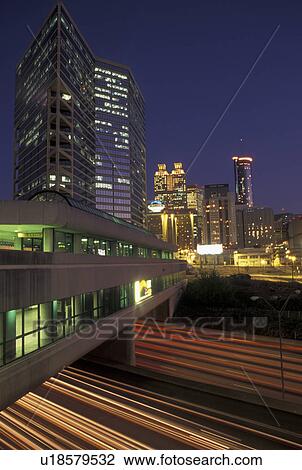 Atlanta, skyline, GA, Georgia, Skyline of downtown Atlanta. Streaks of car lights on Downtown Connector I-75/85 pass under the MARTA station in the evening. View Large Photo Image Stock Image - Atlanta, skyline, GA, Georgia, Skyline of downtown Atlanta. Streaks of car lights on Downtown Connector I-75/85 pass under the MARTA station in the evening.. Fotosearch