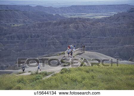 Picture -  Badlands National Park, SD, South Dakota, People looking at the spectacular landscape of the Badlands from Pinnacle Overlook in Badlands Nat'l Park in South Dakota.. Fotosearch