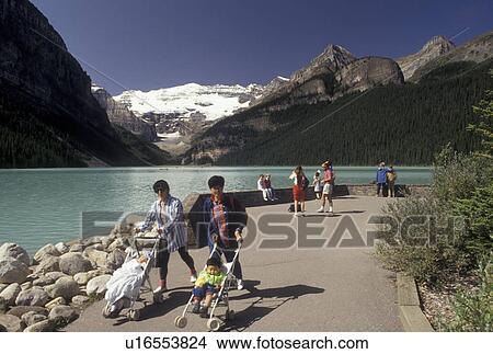 Picture -  Banff National Park, lake, Canada, Alberta, Canadian Rockies, People taking in the sights of Lake Louise and the surrounding mountains in Banff National Park in Alberta.. Fotosearch