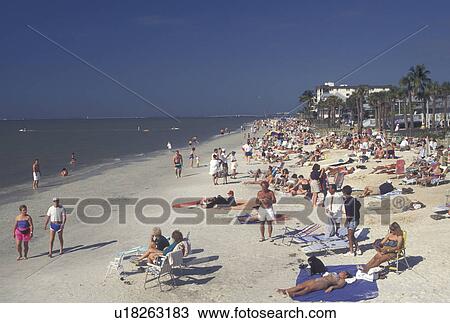 Stock Image -  beach, Fort Myers, FL, Gulf of Mexico, Florida, People enjoying a day at the beach on the Gulf of Mexico in Fort Myers.. Fotosearch