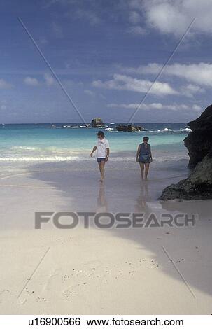 Bermuda, beach, Horseshoe Bay, Southampton Parish, A couple walks on Horseshoe Beach at Horseshoe Bay in Southampton Parish in Bermuda. View Large Photo Image Stock Photograph - Bermuda, beach, Horseshoe Bay, Southampton Parish, A couple walks on Horseshoe Beach at Horseshoe Bay in Southampton Parish in Bermuda. . Fotosearch