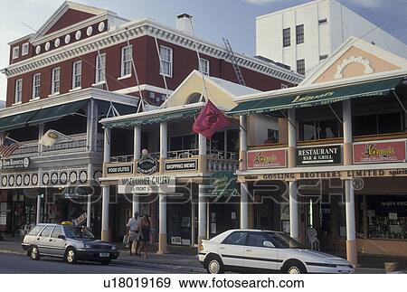 Stock Photo -  Bermuda, Hamilton, Shops along Front Street in the town of Hamilton in Bermuda., . Fotosearch