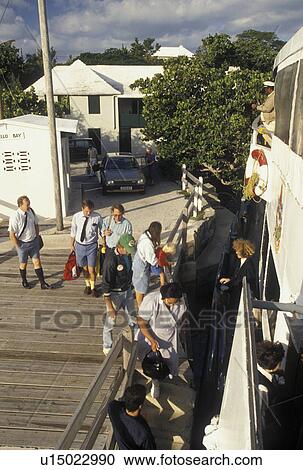 Stock Image -  Bermuda, Somerset, The West End, Sandy's Parish, Passenger boarding Cavello Bay Ferry at the ferry terminal in Somerset in Bermuda. . Fotosearch