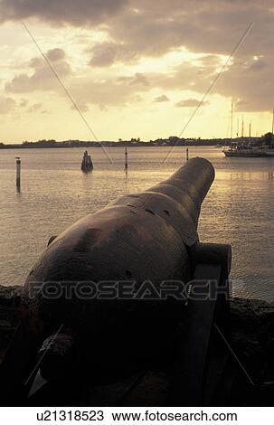 Bermuda, St. George's Parish, Cannon overlooking St. George's Harbor at sunset in St George in Bermuda., View Large Photo Image Stock Image - Bermuda, St. George's Parish, Cannon overlooking St. George's Harbor at sunset in St George in Bermuda., . Fotosearch