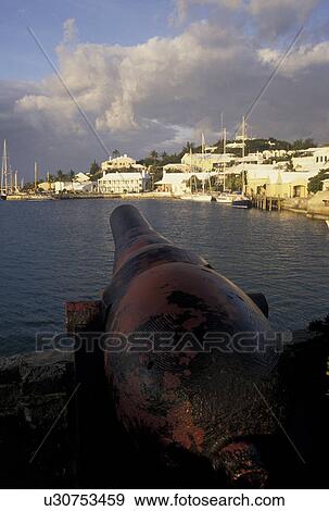 Bermuda, St. George's Parish, Cannon overlooking St. George's Harbor in St George in Bermuda., View Large Photo Image Stock Photo - Bermuda, St. George's Parish, Cannon overlooking St. George's Harbor in St George in Bermuda., . Fotosearch