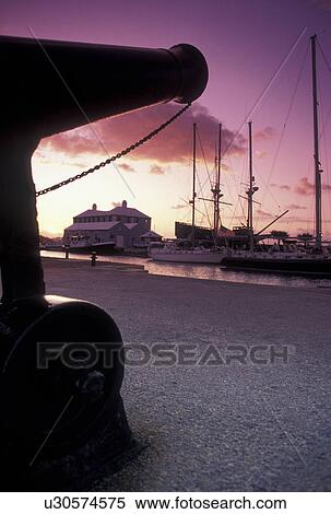 Bermuda, St. George's Parish, Cannon overlooking St. George's Harbor at sunrise in St George in Bermuda., View Large Photo Image Stock Photography - Bermuda, St. George's Parish, Cannon overlooking St. George's Harbor at sunrise in St George in Bermuda., . Fotosearch
