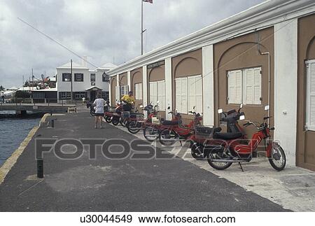 Bermuda, St. George's Parish, Mopeds parked outside the Visitor Service Bureau in St George in Bermuda., View Large Photo Image Stock Photo - Bermuda, St. George's Parish, Mopeds parked outside the Visitor Service Bureau in St George in Bermuda., . Fotosearch