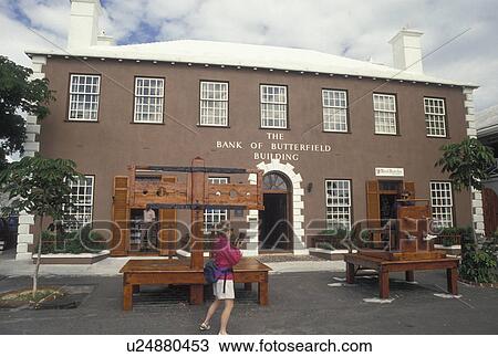 Stock Image -  Bermuda, St. George's Parish, Stockades in Front of the Bank of Butterfield Building in King's Square in St George in Bermuda., . Fotosearch