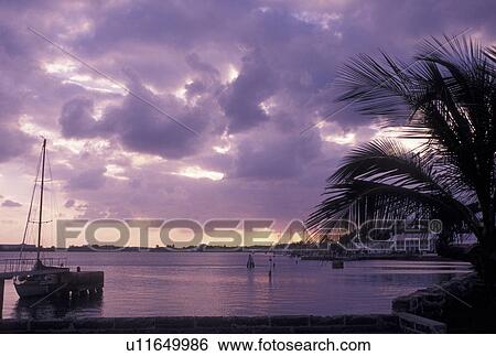 Stock Photograph -  Bermuda, St. George's Parish, Sunset on St. George's Harbor in St George in Bermuda., . Fotosearch