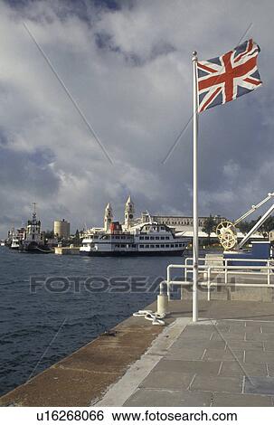 Stock Photograph -  Bermuda, The West End, Sandy's Parish, The British Flag fly's at the Royal Naval Dockyard at the end of Ireland Island in Sandy's Parish in Bermuda. . Fotosearch