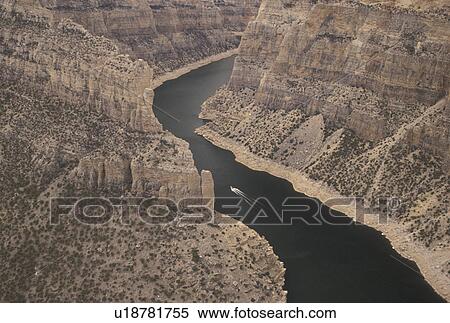 Bighorn Canyon National Recreation Area, Devil Canyon, Bighorn River, MT, WY, Montana, Wyoming, Scenic view of a boat cruising along the Bighorn River from Devil Canyon Overlook in Bighorn Canyon Nat'l Recreation Area in Montana. View Large Photo Image Stock Photography - Bighorn Canyon National Recreation Area, Devil Canyon, Bighorn River, MT, WY, Montana, Wyoming, Scenic view of a boat cruising along the Bighorn River from Devil Canyon Overlook in Bighorn Canyon Nat'l Recreation Area in Montana.. Fotosearch