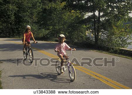 biking, mother, daughter, Stone Mountain, GA, Atlanta, Georgia, Mother and eight year old daughter biking with helmets on at Georgia's Stone Mountain Park in Stone Mountain. View Large Photo Image Stock Photo - biking, mother, daughter, Stone Mountain, GA, Atlanta, Georgia, Mother and eight year old daughter biking with helmets on at Georgia's Stone Mountain Park in Stone Mountain. . Fotosearch