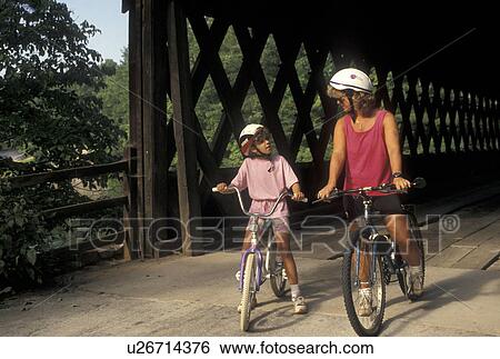 biking, mother, daughter, Stone Mountain, GA, Atlanta, Georgia, Mother and eight year old daughter biking with helmets on at Georgia's Stone Mountain Park in Stone Mountain. View Large Photo Image Stock Photograph - biking, mother, daughter, Stone Mountain, GA, Atlanta, Georgia, Mother and eight year old daughter biking with helmets on at Georgia's Stone Mountain Park in Stone Mountain. . Fotosearch