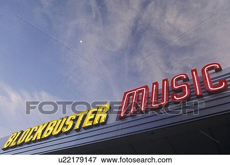 Stock Photo -  Blockbuster Music. Neon lights at Blockbuster Music outside the shops at the Plaza on Ponce de Leon in the evening in Atlanta, Georgia, GA . Fotosearch
