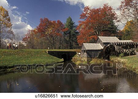 Stock Image -  Blue Ridge, grist mill, VA, Virginia, Scenic view of Mabry Mill surrounded by colorful fall foliage along the Blue Ridge Parkway in autumn in Virginia.. Fotosearch