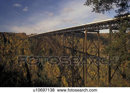bridge, New River Gorge, WV, fall foliage, West Virginia, New River Gorge Bridge, the world's longest steel-arch span bridge, crosses the New River at the New River Gorge National River in Fayetteville in autumn. View Large Photo Image Stock Photo - bridge, New River Gorge, WV, fall foliage, West Virginia, New River Gorge Bridge, the world's longest steel-arch span bridge, crosses the New River at the New River Gorge National River in Fayetteville in autumn.. Fotosearch