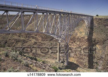 bridge, Rio Grande, NM, New Mexico, Rio Grande River, The three-span continuous-truss bridge crosses the Rio Grande Gorge near Taos. One of the highest bridges in the United States. View Large Photo Image Stock Photo - bridge, Rio Grande, NM, New Mexico, Rio Grande River, The three-span continuous-truss bridge crosses the Rio Grande Gorge near Taos. One of the highest bridges in the United States.. Fotosearch