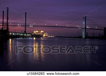 Stock Image -  bridge, Savannah, GA, Georgia, Talmadge Memorial Bridge crossing the Savannah River in the evening in Savannah.. Fotosearch