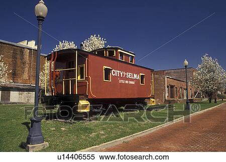 Stock Photography -  caboose, city park, Selma, Alabama, AL, Little Red Caboose displayed in Lafayette Park in Selma in the spring.. Fotosearch