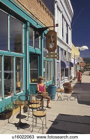 cafT, CO, Creede, Colorado, Woman sitting at an outdoor cafT in the Silver Mining Town of Creede. View Large Photo Image Stock Image - cafT, CO, Creede, Colorado, Woman sitting at an outdoor cafT in the Silver Mining Town of Creede.. Fotosearch