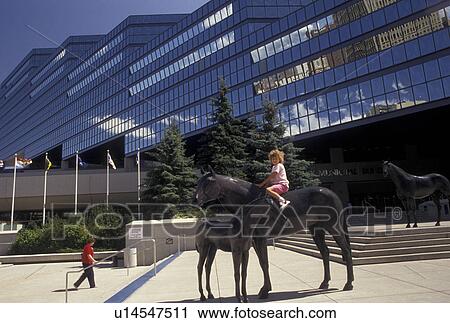 Calgary, City Hall, Canada, Alberta, Young girl sitting on horse statue in front of City Hall in downtown Calgary. View Large Photo Image Stock Image - Calgary, City Hall, Canada, Alberta, Young girl sitting on horse statue in front of City Hall in downtown Calgary.. Fotosearch