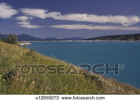 Stock Image -  Canada, Alberta, Scenic view of the turquoise colored Abraham Lake in Alberta . Fotosearch