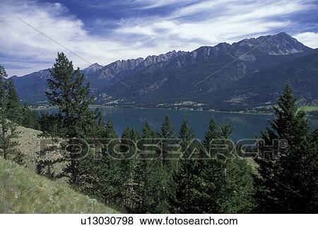 Canada, British Columbia, Canadian Rockies, Scenic view of Columbia Lake and the surrounding Rocky Mountains in British Columbia. View Large Photo Image Stock Photo - Canada, British Columbia, Canadian Rockies, Scenic view of Columbia Lake and the surrounding Rocky Mountains in British Columbia.. Fotosearch