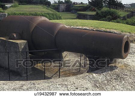 Stock Photo -  cannon, fort, Bermuda, Hamilton, A cannon sits on top of the ramparts at Fort Hamilton in Bermuda. . Fotosearch
