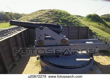 Stock Photo -  cannon, Fort Fisher, North Carolina, Kure Beach, NC, Cannon displayed on the ramparts at Fort Fisher State Historic Site at Kure Beach.. Fotosearch