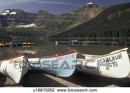 canoe, Canada, Alberta, Waterton Lakes National Park, Canadian Rockies, Canoes resting on the beach on Cameron Lake in Waterton-Glacier International Peace Park in Alberta. View Large Photo Image Stock Image - canoe, Canada, Alberta, Waterton Lakes National Park, Canadian Rockies, Canoes resting on the beach on Cameron Lake in Waterton-Glacier International Peace Park in Alberta.. Fotosearch