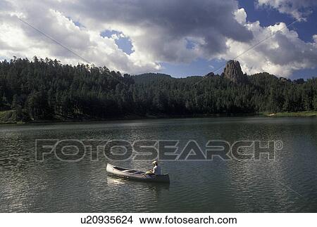 canoeing, SD, South Dakota, Black Hills, Man canoeing on Horse Thief Lake in Black Hills National Forest. View Large Photo Image Picture - canoeing, SD, South Dakota, Black Hills, Man canoeing on Horse Thief Lake in Black Hills National Forest.. Fotosearch