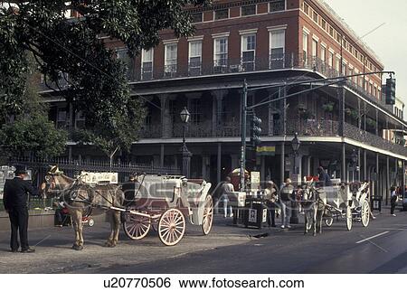 Stock Photograph -  carriage ride, New Orleans, French Quarter, Louisiana, LA, Carriage rides on Decatur Street in the French Quarter of New Orleans. . Fotosearch