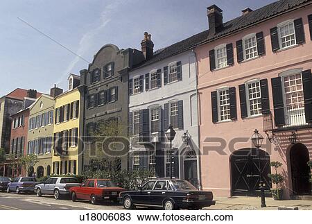Stock Image -  Charleston, South Carolina, SC, Rainbow Row, a collection of colorful historical houses, along East Bay Street in Charleston in the spring.. Fotosearch